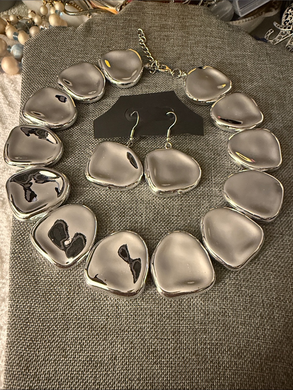 Sculpted Metallic Statement Necklace in Silver tone with matching earrings